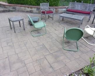 Teak patio set (table and chairs, love seat/bench, two arm chairs, 2 end tables and coffee table) and vintage metal rocker chairs (3).