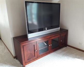 Entertainment Unit with 50" TV.  Glass/Wood doors and storage within.
