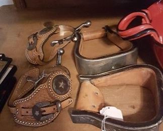 leather and silver  spurs and stirrups