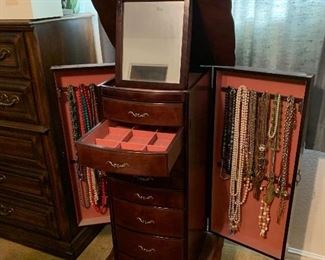 What every woman needs, a beautiful jewelry chest that will hold everything.  The drawers are lined.  Two side opening doors for necklaces and a mirror to admire yourself.