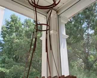 Antique metal clothes rack .