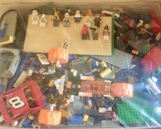 Large bins of Legos with Lego People
