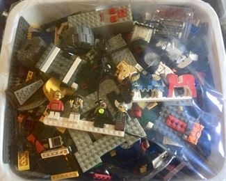 Large bins of Legos with Lego People