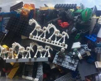 Large bins of Legos with Lego People