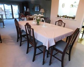 SOLD Gorgeous 8 pc burled mahogany dining room set: Buffet 66"W x 20.75"D x 37"H,  Dining room table with leaf & custom pad 41.5"D x 79"W x 30"H (6) padded seat chairs (1) arm (5) side