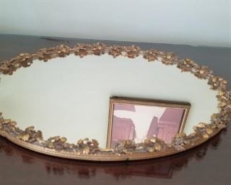 Antique ornate brass trimmed dresser mirror
