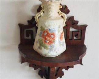 Poppy vase on ornate wall mount shelf
