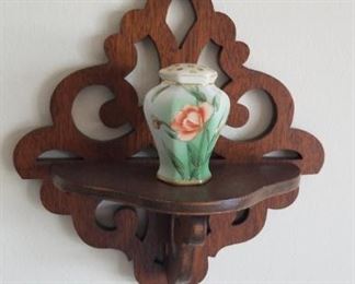 Poppy decor on ornate wall mount shelf