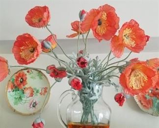 Artificial poppies in vase