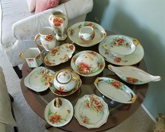 Assorted gold-rimmed poppy painted China