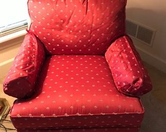 A pair of red comfy chairs