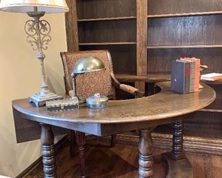 Wonderful half round desk and wood/upholstered chair. wrought iron lamp, vintage brass desk lamp and vintage books 