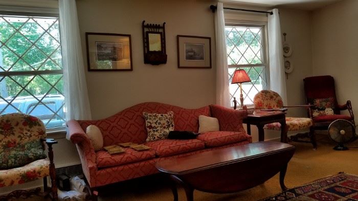 living room, formal sofa, coffee table, side chairs, signed artwork, mirrors, area rugs