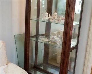 lighted curio cabinet with glass shelves