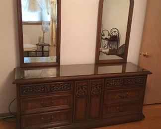Dresser with two attached mirrors