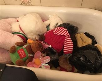 Assortment of stuffed animals in vintage claw foot tub which is also for sale