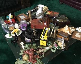 Coffee table, glass top; items on table