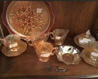 Items in cabinet - most all pieces are Jeanette Amber Glass