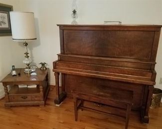Upright piano and bench