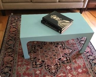 Designer coffee table and oriental rug