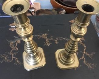 Pair of antique push up brass candlesticks