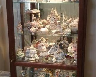 Full curio cabinet..Lladros, Dresden figurines and collectibles