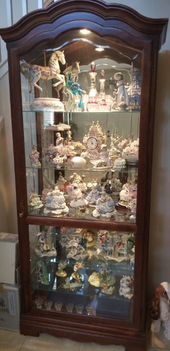 Full curio cabinet..Lladros, Dresden figurines and collectibles 