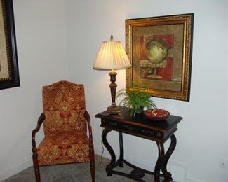 Upholstered arm chair and table
