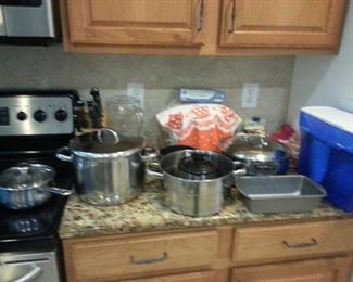 good selection of pots, pans and kitchen equipment