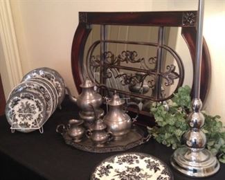 Mirror; pewter tea set; black and white plates; one of two silver lamps