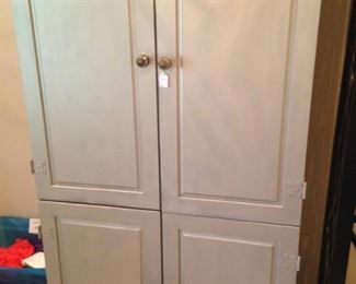 Gray armoire provides great storage