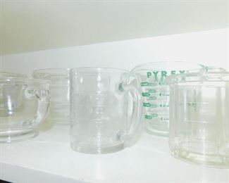 Several vintage measuring cups