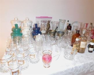 Collection of vintage apothecary/pharmacy beakers, jars, mortar and pestle sets, medicine bottles from Hildebrandt Drugs in Downtown Normal.