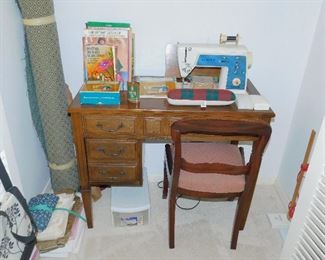 Singer zig-zag machine in cabinet with tons of accessories and original instruction book