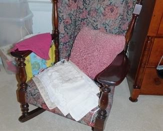 Vintage rocker, cashmere scarf, lots of vintage pillow covers with embroidery and lace