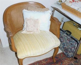 Vintage arm chair, older woven rug