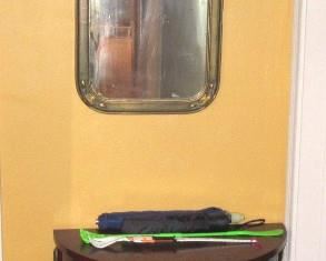 toledo half moon table with mirror in hall