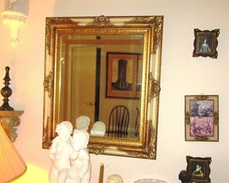 toledo mirror and table with statues