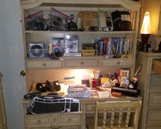 Vintage desk/hutch with chair. Office supplies, DVDs, Blue Ray Discs, CDs, Wii games, Nintendo Gamecube charger/memory card/games, phones (vintage & modern), lava lamps, & CD cases/stand & more.