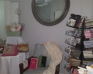 Accent chair, stationary (Crane & more), & paper napkins from Kimberly's closeout, linens, & large round mirror.
