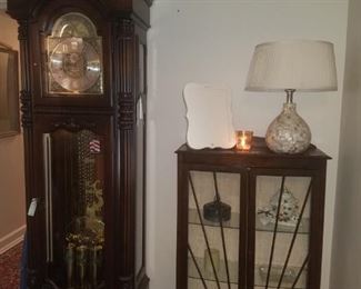 Howard Miller grandfather clock from the presidential series, Ronald Reagan. English imported small china/curio cabinet, table lamp, & more.