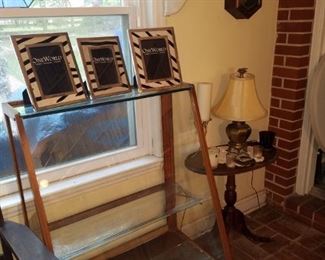 Antique display cabinet from the family beauty shop, frames (from Kimberly's closeout), accent table, table lamp, & more.