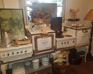 Hotpoint electric enamel stoves, enamelware server/warmer, wooden ice cream churn, iron skillet, art, cotton bale, & more.