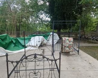 Two full size metal beds one with canopy rails.