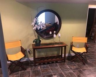 faux bamboo directors chairs and consold table. Another large round mirror