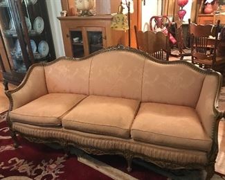 Beautiful 1930-40's 3 cushion sofa with carved back and arms.