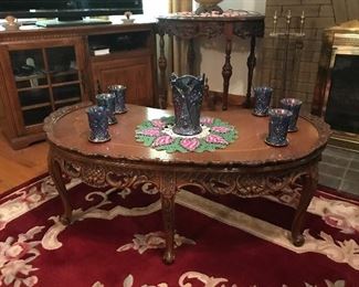 This is an credible carved curved French Provincial coffee table.