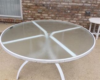White glass top table round and no chairs
