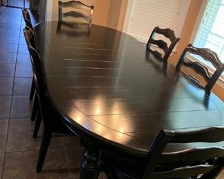 Black oak Wooden kitchen table with a wide top in mint condition paid over $2000 for it. Also, come with 4 matching stool for the kitchen counter.