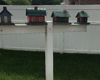 4 birdhouses on a pole
